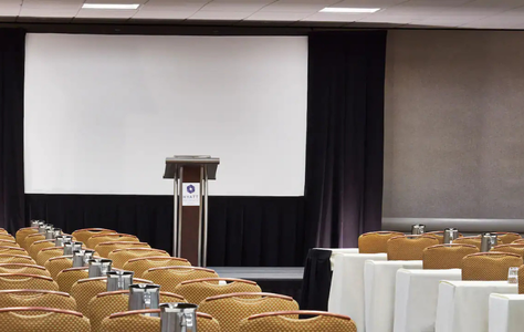 conference room with stage seating and presentation setup